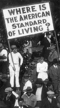 protest sign: Where Is the American Standard of Living?