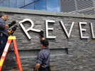 Revels sign being taken down--thumb