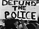 Defund police protest sign