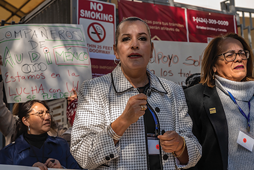 Patricia Santana Bautista speaking at the rally for striking Audi workers, Los Angeles, February 10, 2024.  Credit: © David Bacon. 