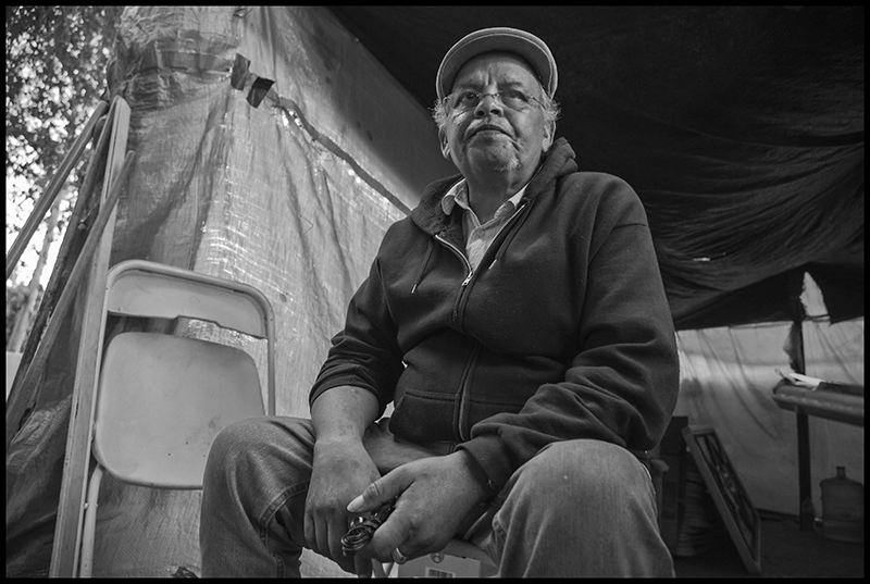 Ruben Beas in the tent where he sleeps.