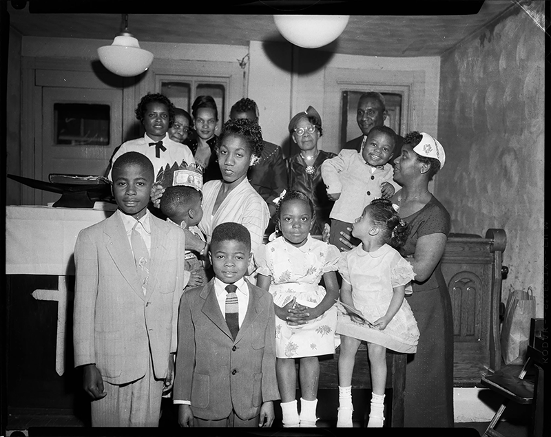 Women, children, and a man in the interior of small church in Pittsburgh, Penn., c. 1950-1970.